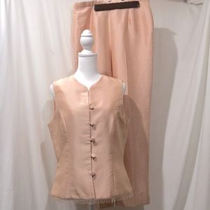 A sleeveless tuxedo style pants suit